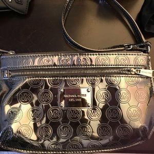 Authentic Michael Kors silver wristlet